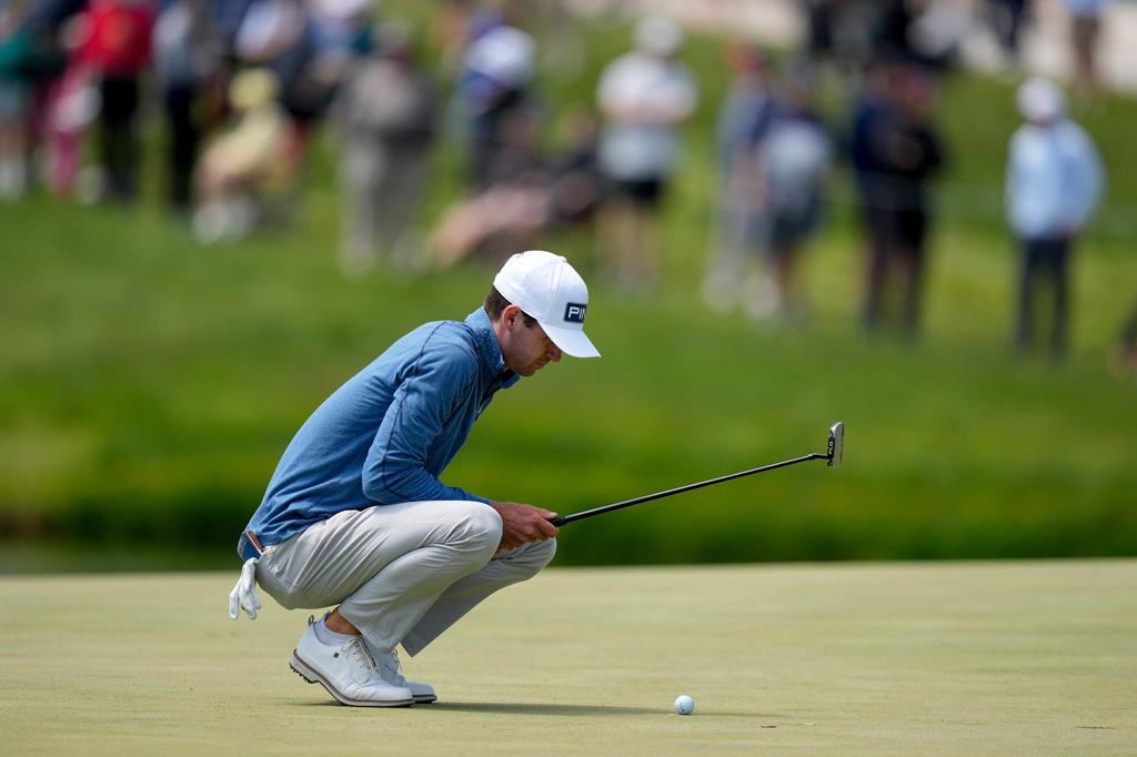 Alex Smalley lines up his shot on the 17th green during the second round of the PGA Championship golf tournament at Aronimink Golf Club, Friday, May 15, 2026, in Newtown Square, PA. (AP Photo/Matt Slocum)