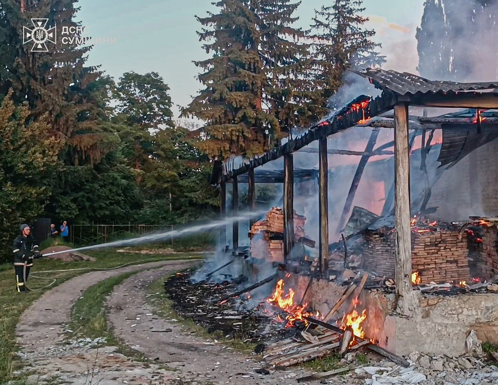 In this photo, provided by the Ukrainian Emergency Service, firefighters extinguish a fire in a residential building following a Russian drone attack in Sumy region, Ukraine, Friday, June 26, 2026. (Ukrainian Emergency Service via AP)