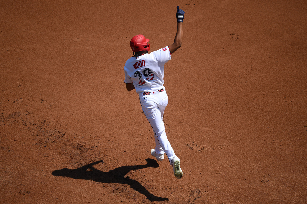 Washington Nationals' James Wood celebrates his solo home run as he rounds the bases during the first inning of a baseball game against the Pittsburgh Pirates, Saturday, July 4, 2026, in Washington. (AP Photo/Nick Wass)