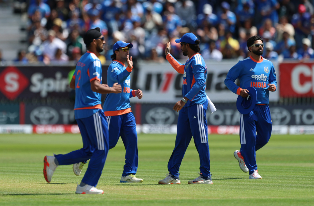 India's players celebrate the wicket of Ireland's Ross Adair during the second T20 Test match between Ireland and India in Belfast, Ireland, Sunday, June 28, 2026. (Liam McBurney/PA via AP)
