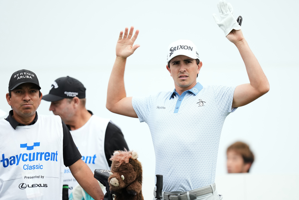 Nico Echavarria of Colombia stretches before teeing off on the first hole during the first round of the Baycurrent Classic golf tournament at the Yokohama Country Club in Yokohama, near Tokyo, Thursday, Oct. 9, 2025. (AP Photo/Hiro Komae)