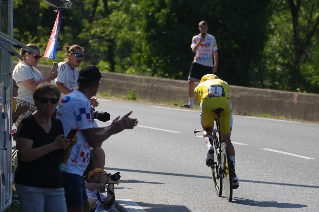 Slovenia's Tadej Pogacar, wearing the overall leader's yellow jersey, rides during the sixteenth stage of the Tour de France cycling race, an indivdual time-trial with start in Evian-Les-Bains and finish in Thonon-les-Bains, France, Tuesday, July 21, 2026. (AP Photo/Thibault Camus)