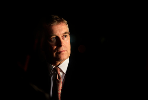 FILE - Britain's Prince Andrew looks on during an event at the residence of the British Ambassador in New Delhi, India, March 10, 2010. (AP Photo/Manish Swarup, File) FILE - Britain's Prince Andrew looks on during an event at the residence of the British Ambassador in New Delhi, India, March 10, 2010. (AP Photo/Manish Swarup, File)
