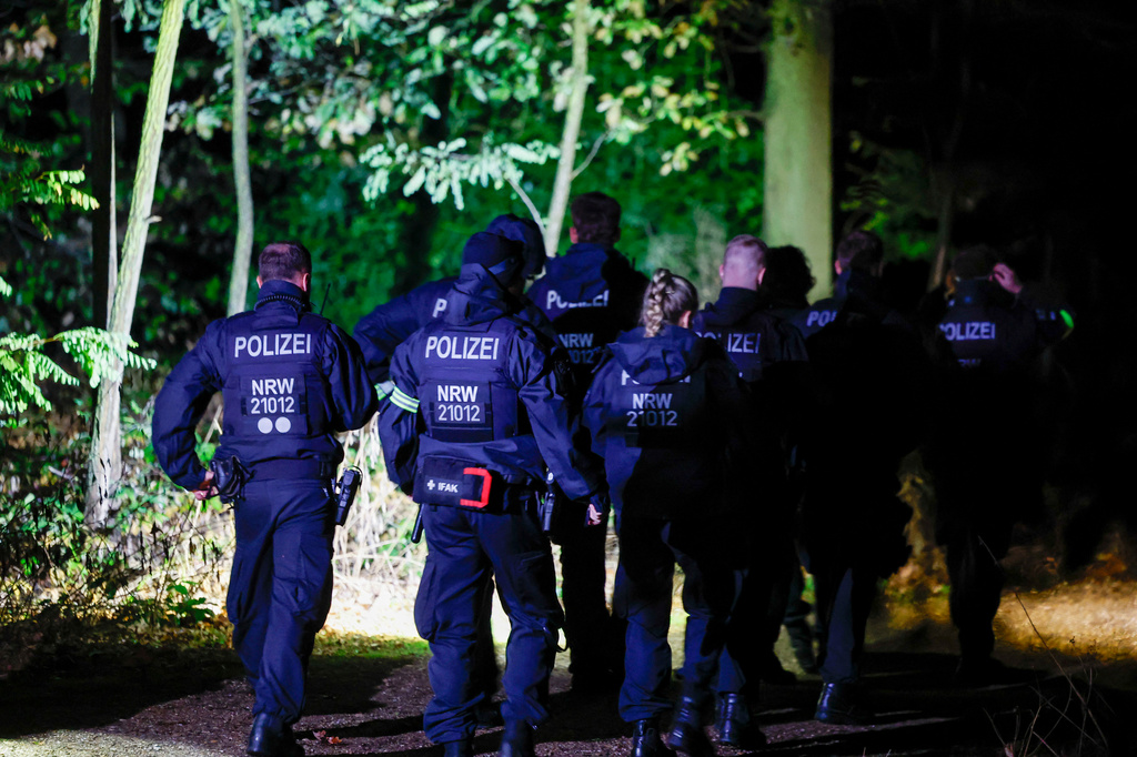 Federal Police officers search for a suspect in Hambach Forest in the area of a truck parked in Niederzier, Germany, on Friday, Sept. 4, 2026, in connection with several acts of sabotage against the German power grid. (Thomas Banneyer/dpa via AP)