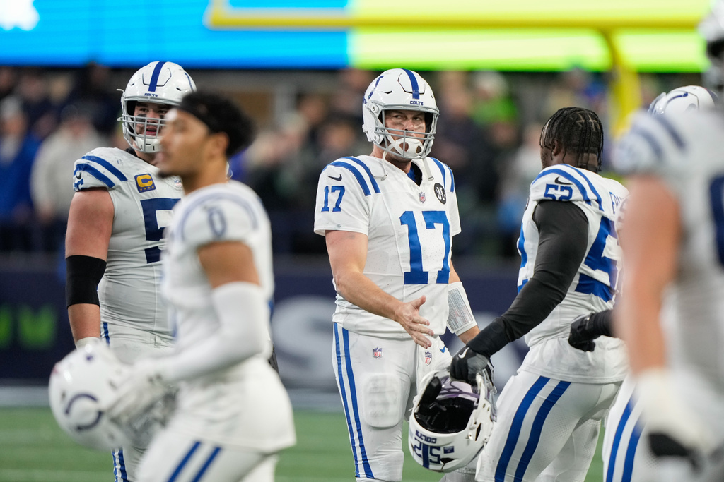 Indianapolis Colts quarterback Philip Rivers (17) walks off the field after throwing an interception in the second half of an NFL football game against the Seattle Seahawks, Sunday, Dec. 14, 2025, in Seattle. (AP Photo/Stephen Brashear)