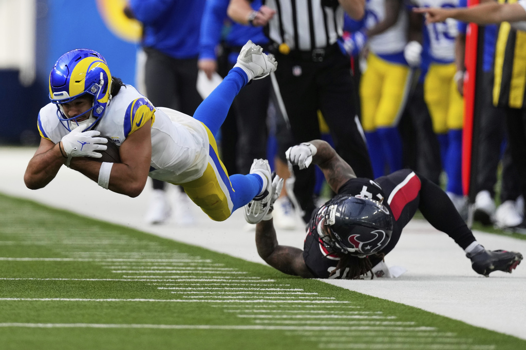 Los Angeles Rams wide receiver Puka Nacua, left, is tackled by Houston Texans cornerback Derek Stingley Jr. during the second half of an NFL football game, Sunday, Sept. 7, 2025, in Inglewood, Calif. (AP Photo/Mark J. Terrill)