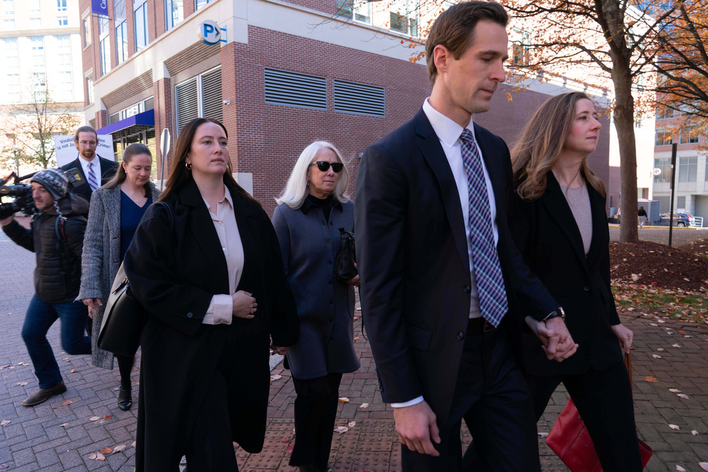 Former FBI Director James Comey's family leaves the federal courthouse in Alexandria, Va., Thursday, Nov. 13, 2025. (AP Photo/Jose Luis Magana)