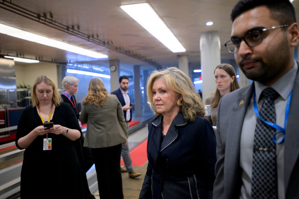 Sen. Marsha Blackburn, R-Tenn., center, walks through the Senate subway during a vote at the Capitol, Tuesday, Jan. 6, 2026, in Washington. (AP Photo/Rod Lamkey, Jr.)