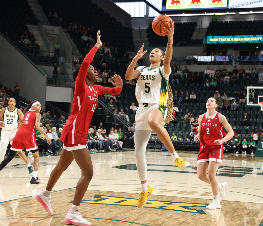 Baylor forward Darianna Littlepage-Buggs (5) goes up to shoot between Texas Tech forward Sarengbe Sanogo (11) and guard Gemma Nunez (2) in the first half of an NCAA college basketball game, Sunday, Dec. 21, 2025, in Waco, Texas. (Rod Aydelotte/Waco Tribune-Herald via AP)