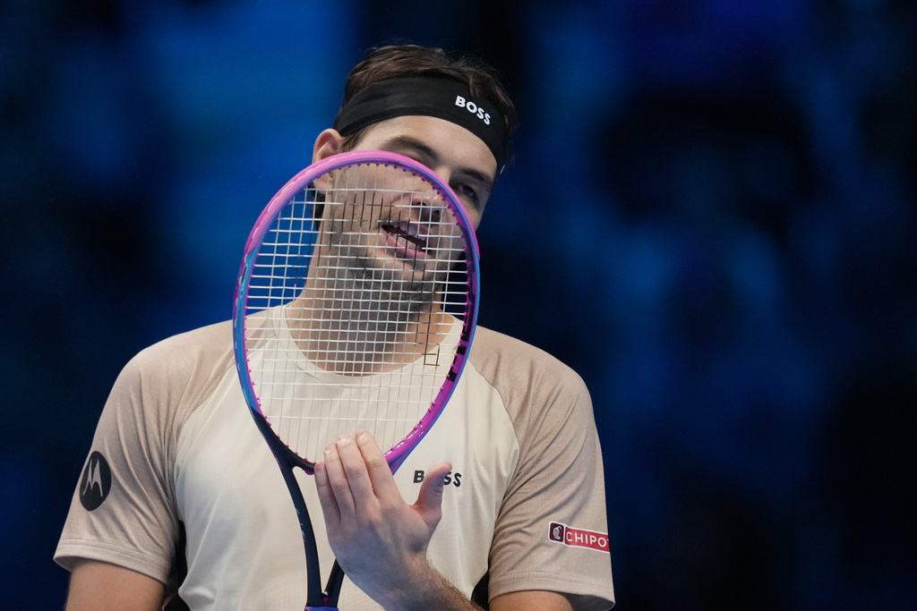 United States' Taylor Fritz reacts after losing a point against Australia's Alex de Minaur during their tennis match of the ATP World Tour Finals, in Turin, Italy, Thursday, Nov. 13, 2025. (AP Photo/Antonio Calanni)