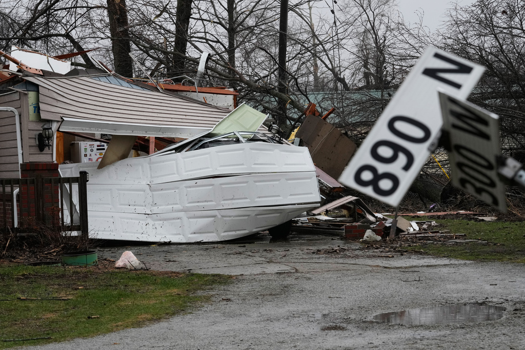 Wind damage and debris sit at a home in the aftermath of a powerful storm that ripped through the area a day earlier in Lake Village, Ind., Wednesday, March 11, 2026. (AP Photo/Nam Y. Huh)