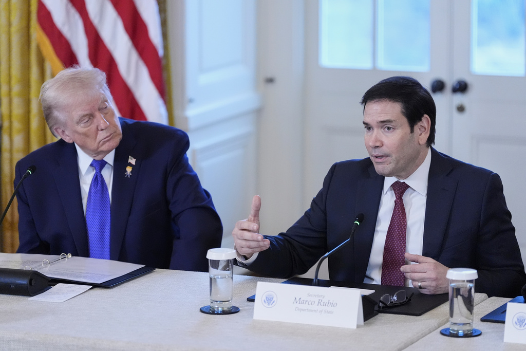 President Donald Trump listens to Sec. of State Marco Rubio speak during a meeting with oil executives in the East Room of the White House, Friday, Jan. 9, 2026, in Washington. (AP Photo/Alex Brandon)