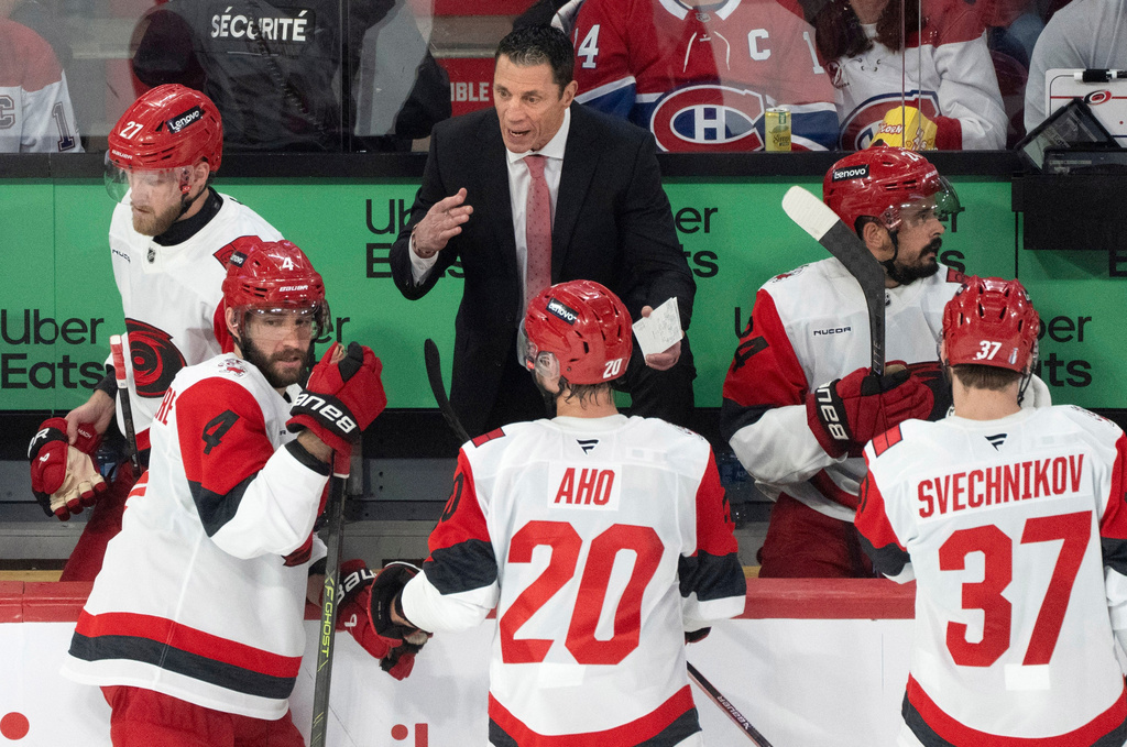 Carolina Hurricanes head coach Rod Brind'Amour, center top, instructs his players during the third period of Game 3 of the Eastern Conference finals NHL hockey Stanley Cup playoff series against the Montreal Canadiens in Montreal, Monday, May 25, 2026. (Christinne Muschi/The Canadian Press via AP)