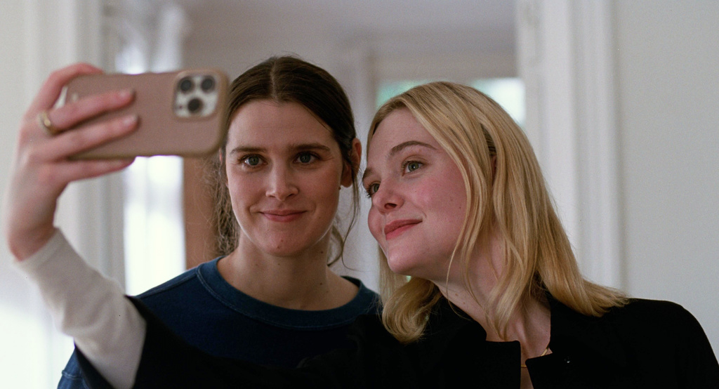 This image released by Neon shows Inga Ibsdotter Lilleaas, left, and Elle Fanning in a scene from "Sentimental Value." (Kasper Tuxen/Neon via AP)