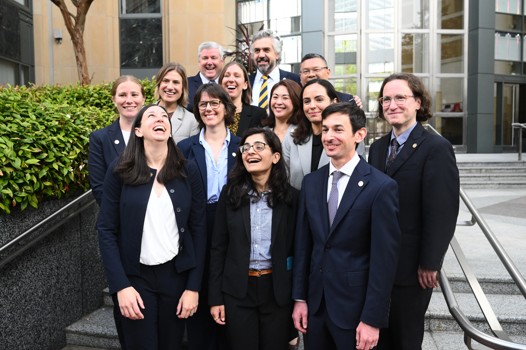Members of California's legal team gather outside court after a settlement was reached in a multi-state lawsuit accusing Meta of causing harm to children on social media outside the Ronald V. Dellums Federal Building and U.S. Courthouse on Wednesday, Aug. 26, 2026, in Oakland, Calif. (AP Photo/Noah Berger)