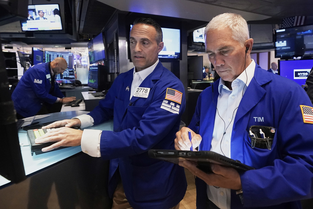 Specialist Michael Gagliano, left, and trader Timothy Nick work on the floor of the New York Stock Exchange, Wednesday, Sept. 17, 2025. (AP Photo/Richard Drew)