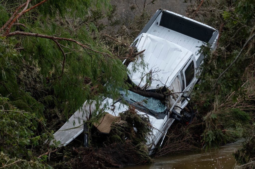 Flood debris and damage scatter the area near Buckhorn Lake Resort RV Park following floods along West Goat Creek near the Guadalupe River on Friday, July 17, 2026, in Kerrville, Texas. (AP Photo/Joel Angel Juarez)