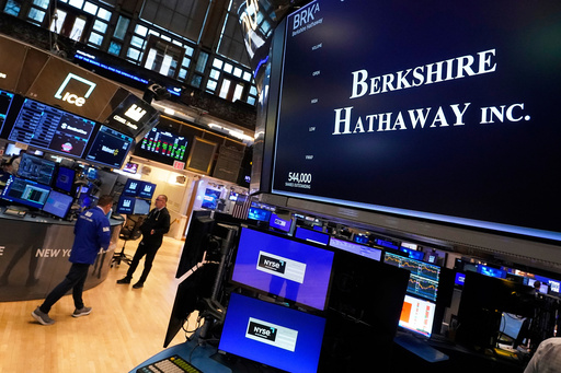 FILE - The logo for Berkshire Hathaway Inc. appears above a trading post on the floor of the New York Stock Exchange, Monday, May 5, 2025. (AP Photo/Richard Drew, File) FILE - The logo for Berkshire Hathaway Inc. appears above a trading post on the floor of the New York Stock Exchange, Monday, May 5, 2025. (AP Photo/Richard Drew, File)