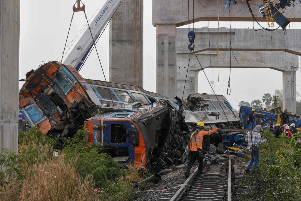 The wreckage after a construction crane fell into a passenger train in Nakhon Ratchasima province, Thailand, Wednesday, Jan.14, 2026. (AP Photo/Sakchai Lalit))