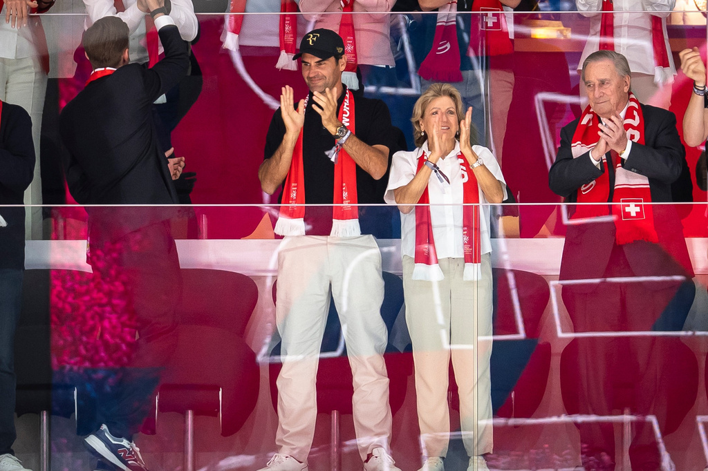 Former professional tennis player Roger Federer, left, and his mother Lynette Federer celebrate after Switzerland won the quarterfinal game between Switzerland and Sweden at the men's ice hockey world championship in Zurich, Switzerland, Thursday, May 28, 2026. (Andreas Becker/Keystone via AP)