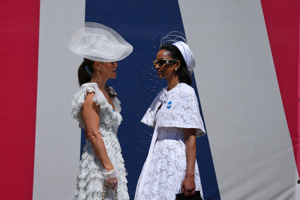 Racegoers arrive on the second day of the Royal Ascot horse race meeting in Ascot, England, Wednesday, June 17, 2026.(AP Photo/Alastair Grant)