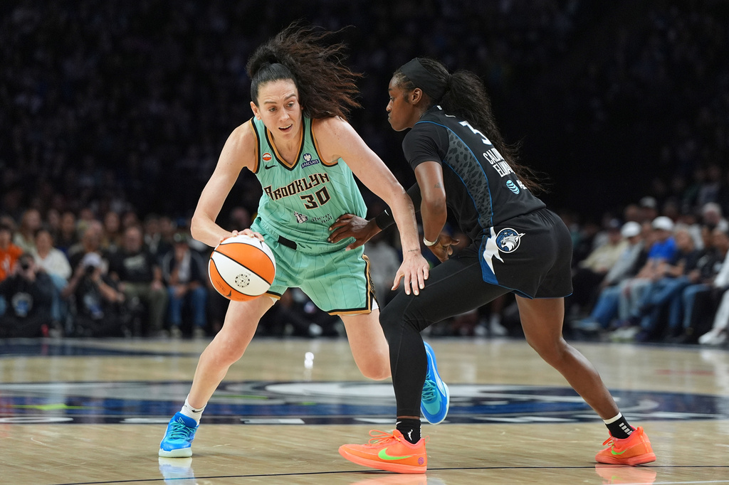 New York Liberty forward Breanna Stewart (30) dribbles downcourt as Minnesota Lynx guard Maya Caldwell (3) defends during the second half of a WNBA basketball game Friday, Sept. 18, 2026, in Minneapolis. (AP Photo/Abbie Parr)