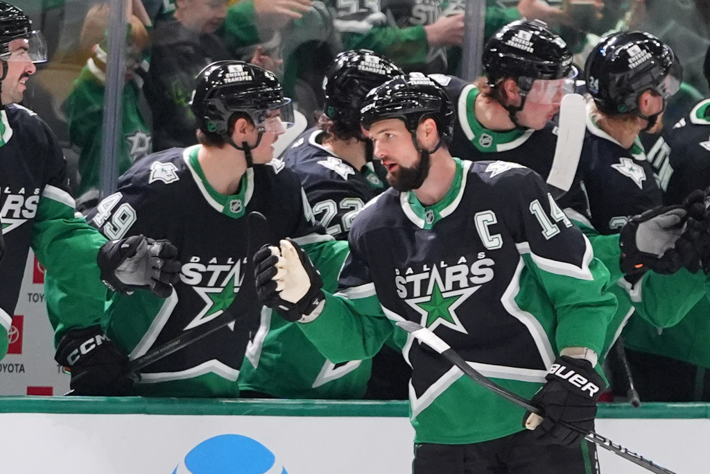 Dallas Stars left wing Jamie Benn (14) celebrates scoring a goal during the second period of an NHL hockey game against the Utah Mammoth Friday, Nov. 28, 2025, in Dallas. (AP Photo/LM Otero)