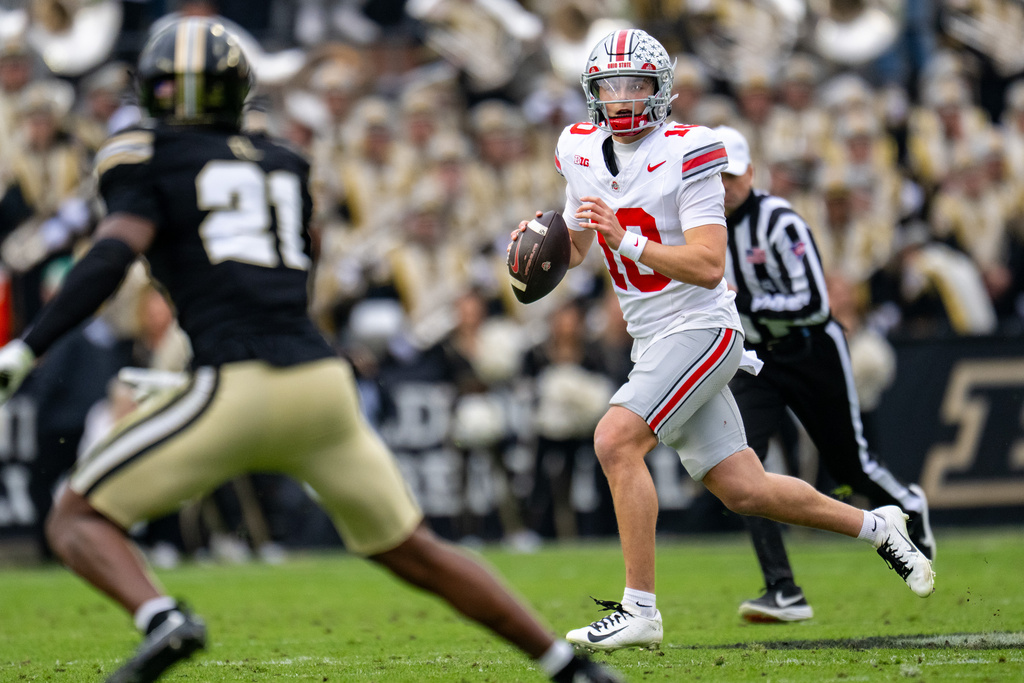 Ohio State quarterback Julian Sayin (10) looks up field for a receiver during the first half of an NCAA college football game against Purdue, Saturday, Nov. 8, 2025, in West Lafayette, Ind. (AP Photo/Doug McSchooler)