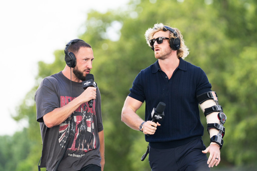 IMPAULSIVE co-hosts Mike Majlak and Logan Paul arrive at UFC Fan Fest on the White House Ellipse ahead of the fights on the South Lawn, Sunday, June 14, 2026, in Washington. (AP Photo/Allison Robbert)