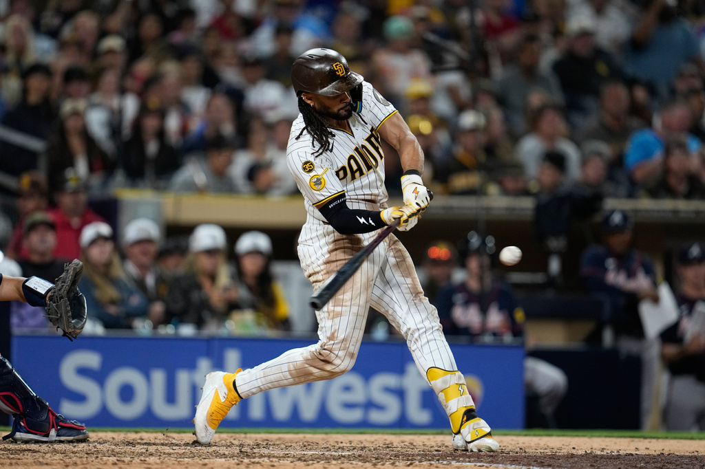 San Diego Padres' Fernando Tatis Jr. hits a home run during the seventh inning of a baseball game against the Atlanta Braves Tuesday, June 23, 2026, in San Diego. (AP Photo/Gregory Bull)