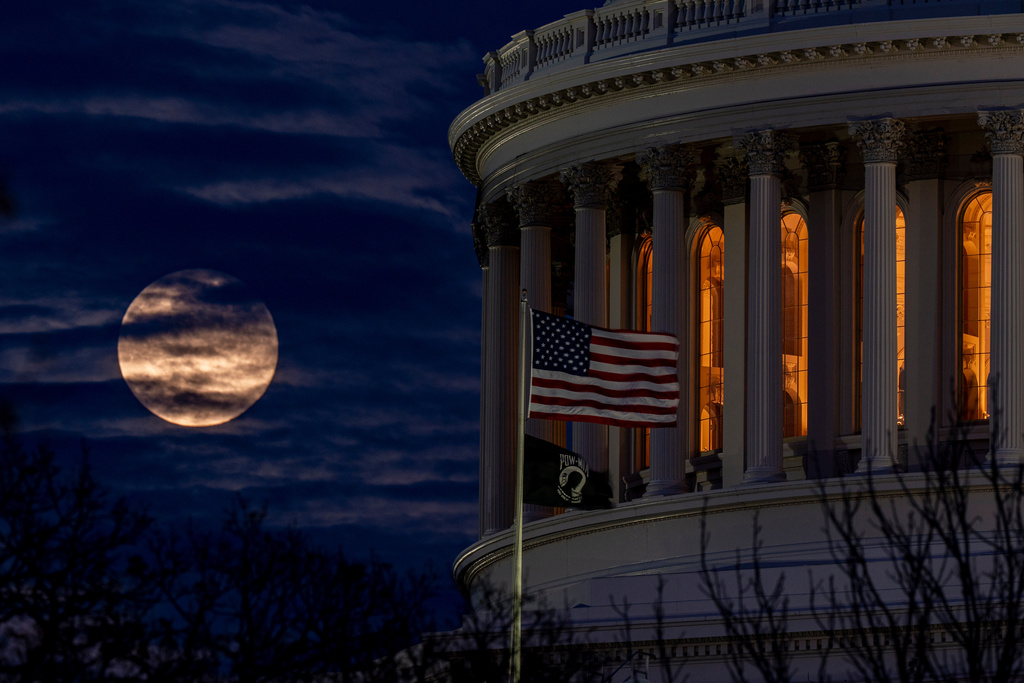 The last super moon of the year, the "Cold Supermoon," rises behind the U.S. Capitol, Thursday, Dec. 4, 2025, in Washington. (AP Photo/Alex Brandon)