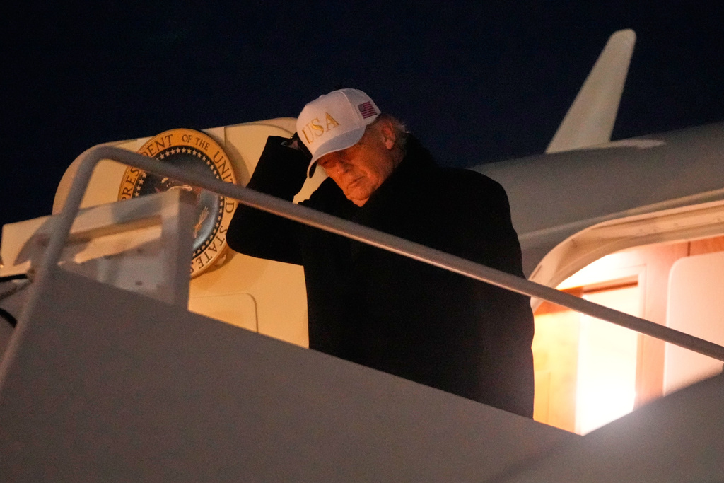 President Donald Trump arrives on Air Force One, Sunday, Feb. 1, 2026, at Joint Base Andrews, Md., after returning from a trip to Florida. (AP Photo/Mark Schiefelbein)
