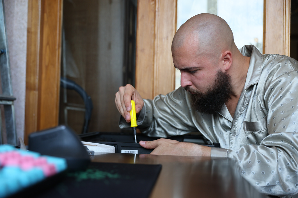 A 28-year-old digital content marketer who recently moved out of Russia is seen in Tbilisi, Georgia, Saturday, Sept. 5, 2026. He asked not to be identified because of security concerns. (AP Photo/Zurab Tsertsvadze)