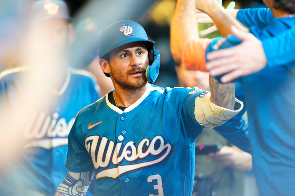 Milwaukee Brewers' Joey Ortiz high-fives teammates after hitting a home run during the fifth inning of a baseball game against the Miami Marlins, Friday, July 17, 2026, in Milwaukee. (AP Photo/Kayla Wolf)