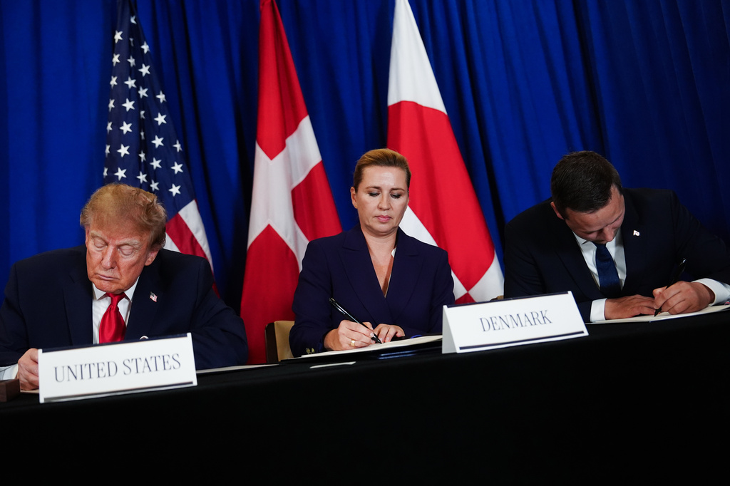 President Donald Trump signs a security agreement with Denmark's Prime Minister Mette Frederiksen and Greenland's Prime Minister Jens-Frederik Nielsen during the United Nations General Assembly, Tuesday, Sept. 22, 2026, at the UN headquarters. (AP Photo/Julia Demaree Nikhinson)