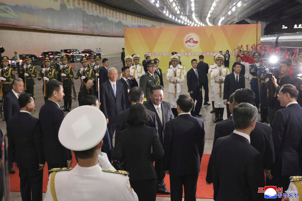 In this photo provided by the North Korean government, North Korean leader Kim Jong Un, center, leaves a Beijing station Thursday, Sept. 4, 2025. Independent journalists were not given access to cover the event depicted in this image distributed by the North Korean government. The content of this image is as provided and cannot be independently verified. Korean language watermark on image as provided by source reads: "KCNA" which is the abbreviation for Korean Central News Agency. (Korean Central News Agency/Korea News Service via AP)