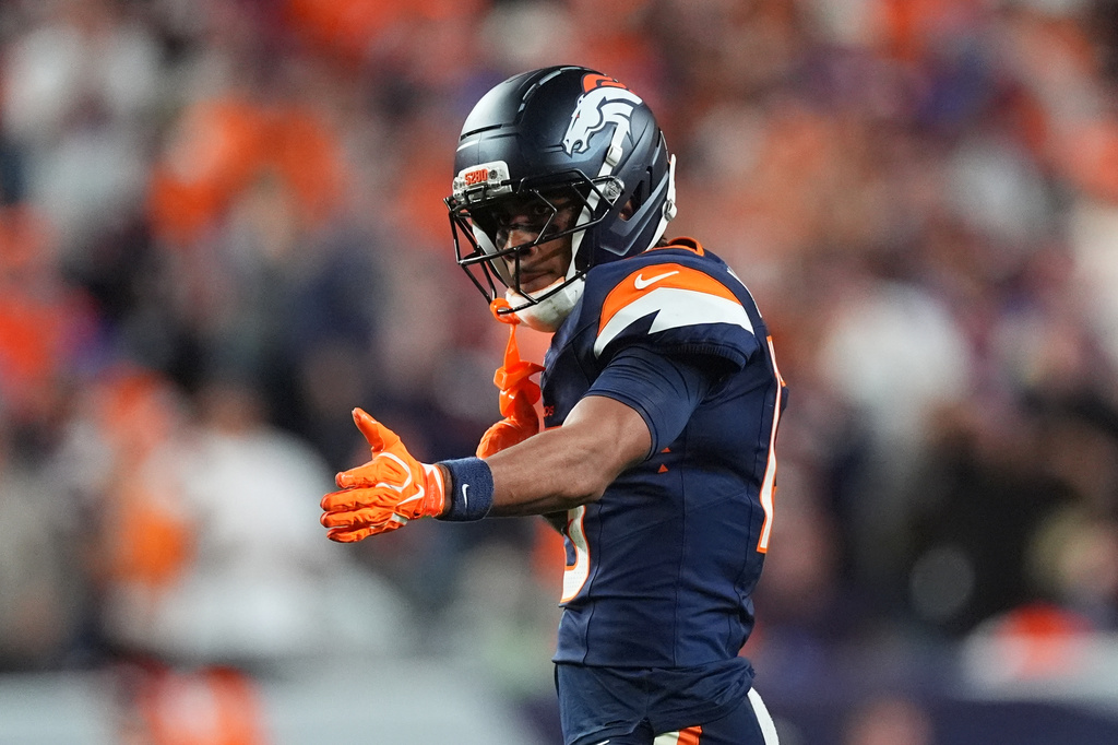Denver Broncos wide receiver Pat Bryant gestures after a catch against the Los Angeles Rams during the second half of an NFL football game Sunday, Sept. 27, 2026, in Denver. (AP Photo/David Zalubowski)