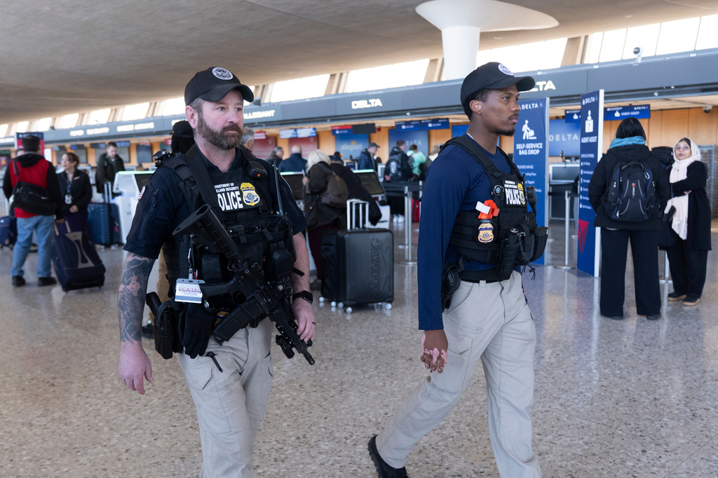 FILE - Department of Homeland Security, Transportation Security Administration, Federal Air Marshals, patrol around Washington Dulles International Airport, in Chantilly, Va., Tuesday, March 24, 2026. (AP Photo/Manuel Balce,File)