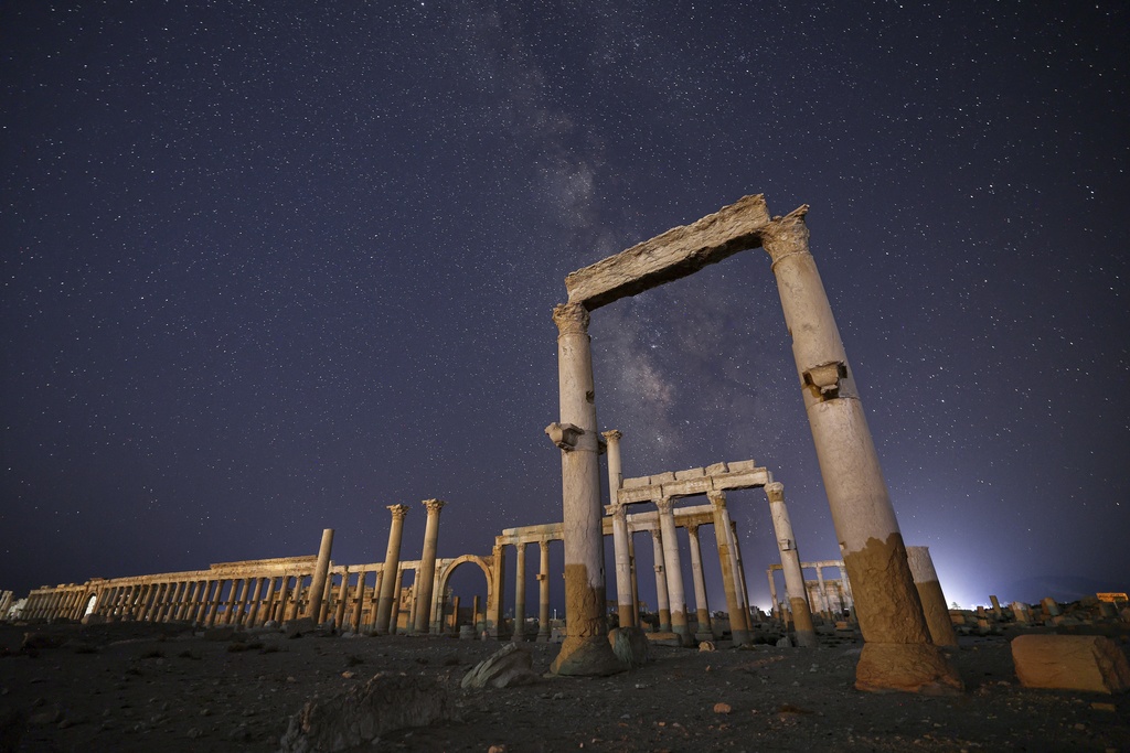 The ruins of the ancient city of Palmyra under a star-studded sky in Syria, in the late hours of Wednesday, Aug. 27, 2025.(AP Photo/Ghaith Alsayed)