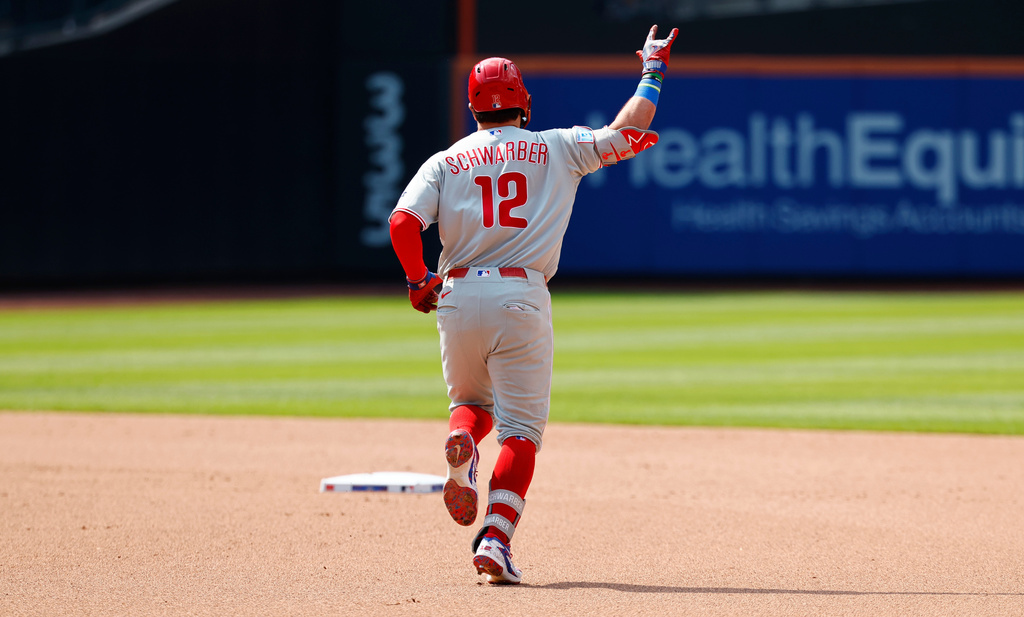 Philadelphia Phillies' Kyle Schwarber celebrates as he runs the the bases after hitting a two-run home run against the New York Mets during the seventh inning of a baseball game, Sunday, June 28, 2026, in New York. (AP Photo/Noah K. Murray)