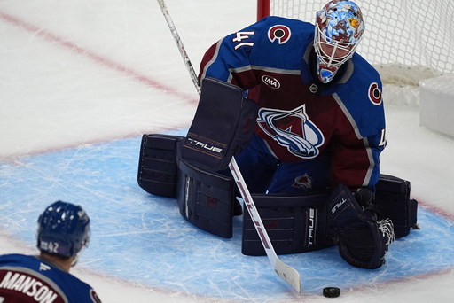 Colorado Avalanche goaltender Scott Wedgewood stops a shot in the third period of an NHL hockey game against the New Jersey Devils Tuesday, Oct. 28, 2025, in Denver. (AP Photo/David Zalubowski) Colorado Avalanche goaltender Scott Wedgewood stops a shot in the third period of an NHL hockey game against the New Jersey Devils Tuesday, Oct. 28, 2025, in Denver. (AP Photo/David Zalubowski)