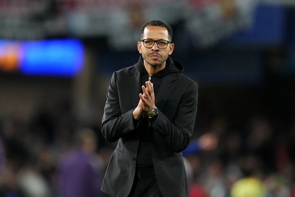 Chelsea's head coach Liam Rosenior leaves the field after the English Premier League soccer match between Chelsea and Manchester United in London, Saturday, April 18, 2026. (AP Photo/Kirsty Wigglesworth)