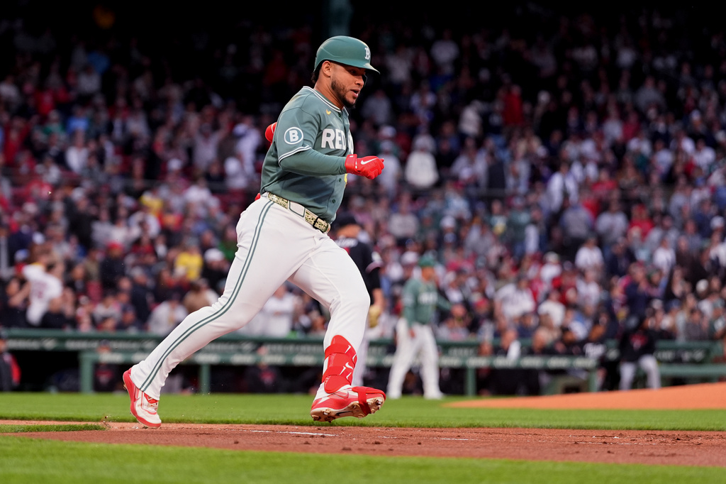 Boston Red Sox's Willson Contreras rounds the bases on his triple during the first inning of a baseball game against the Minnesota Twins, Friday, May 22, 2026, in Boston. (AP Photo/Charles Krupa)