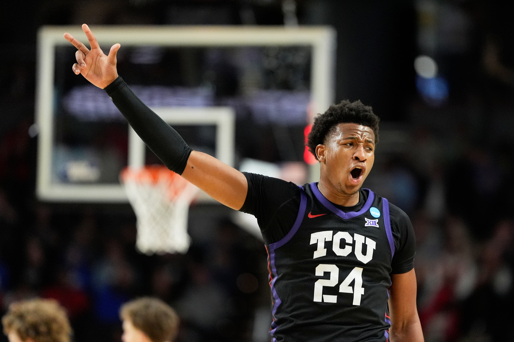 TCU forward Xavier Edmonds celebrates after scoring against Ohio State during the first half in the first round of the NCAA college basketball tournament, Thursday, March 19, 2026, in Greenville, S.C. (AP Photo/Chris Carlson)