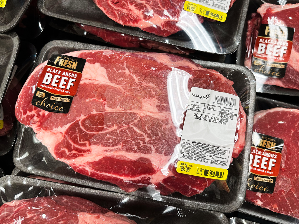 Packages of meat are displayed on a refrigerated case inside a grocery store in Chicago, Thursday, June 25, 2026. (AP Photo/Nam Y. Huh)