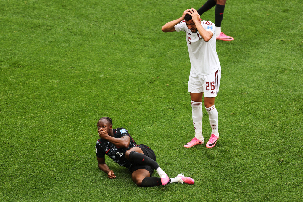 Qatar's Mohamed Manai (26) reacts after Canada's Ismael Kone (8) was injured on a dangerous play during the World Cup Group B soccer match between Canada and Qatar in Vancouver, British Columbia, Thursday, June 18, 2026. (AP Photo/Kaleb Tatum)
