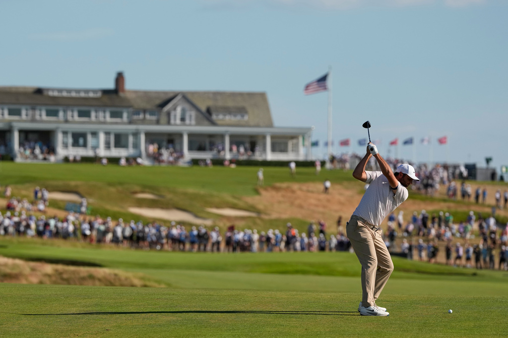 Scottie Scheffler hits from the fairway on the 16th hole during the third round of the U.S. Open golf tournament at Shinnecock Hills Golf Club in Southampton, N.Y., Saturday, June 20, 2026.(AP Photo/David J. Phillip)