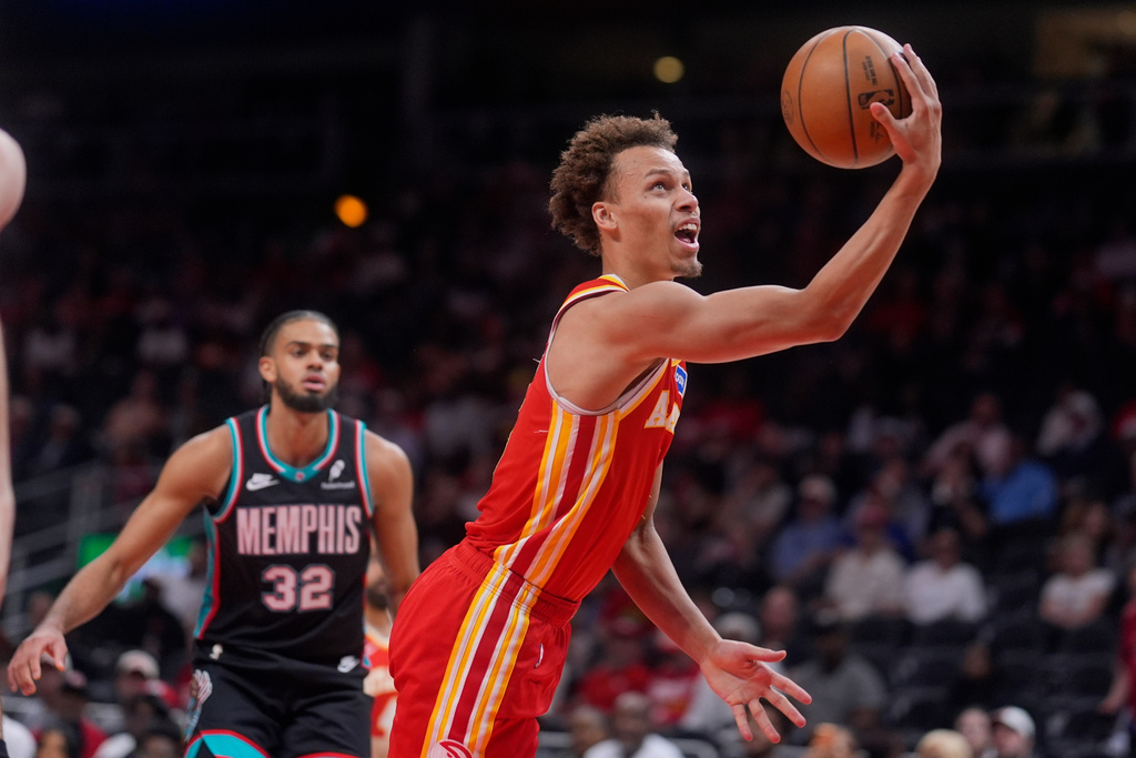 Atlanta Hawks guard Dyson Daniels (5) shoots against the Memphis Grizzlies during the first half of an NBA basketball game, Monday, March 23, 2026, in Atlanta. (AP Photo/Mike Stewart)