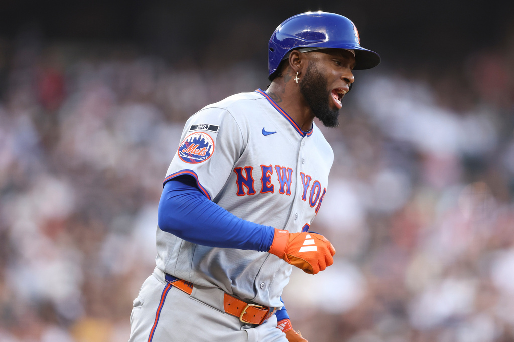 New York Mets' Luis Robert Jr. reacts after hitting a home run during the third inning of a baseball game against the Chicago White Sox in Chicago, Saturday, Aug. 22, 2026. (AP Photo/Jessie Alcheh)