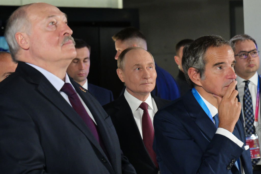 From left, Belarusian President Alexander Lukashenko, Russian President Vladimir Putin and International Atomic Energy Agency (IAEA) Director General Rafael Grossi visit the Atom pavilion at the Exhibition of Achievements of National Economy (VDNKh) ahead of the World Atomic Week forum in Moscow, Russia, Thursday, Sept. 25, 2025. (Alexei Nikolsky, Sputnik, Kremlin Pool Photo via AP)